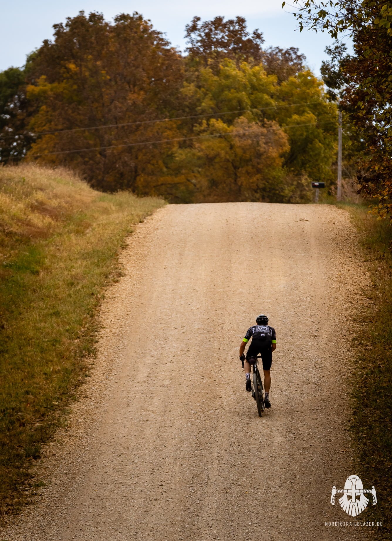 cyclist cycling is a gravel road
