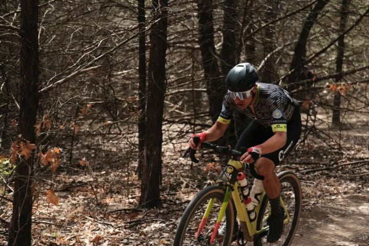 Rider cycling on gravel