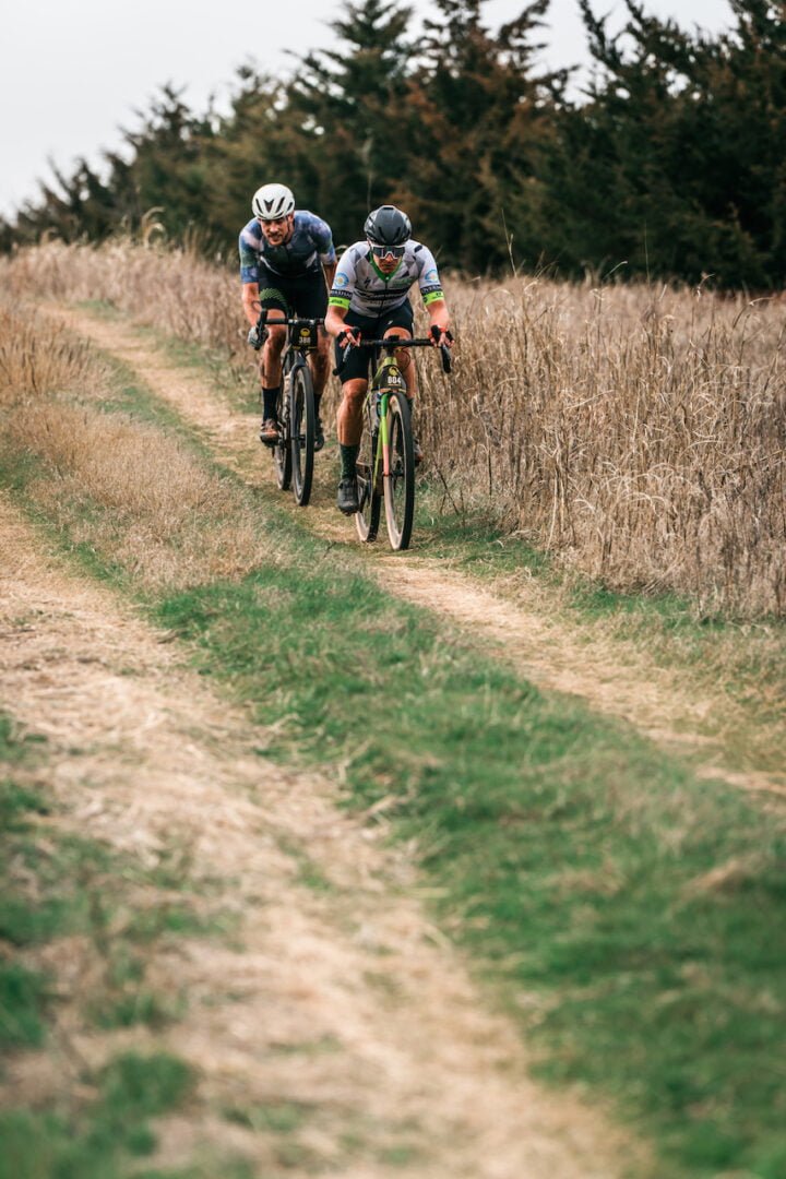 The riders cycling on gravel