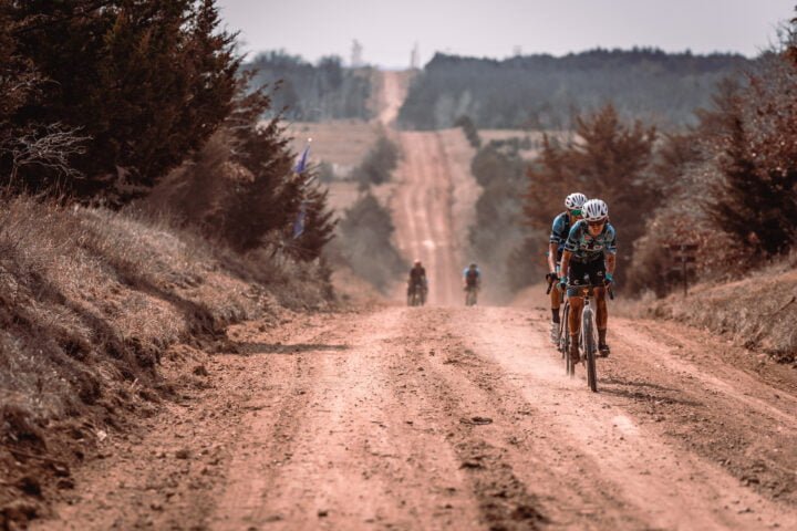 Riders cycling on gravel