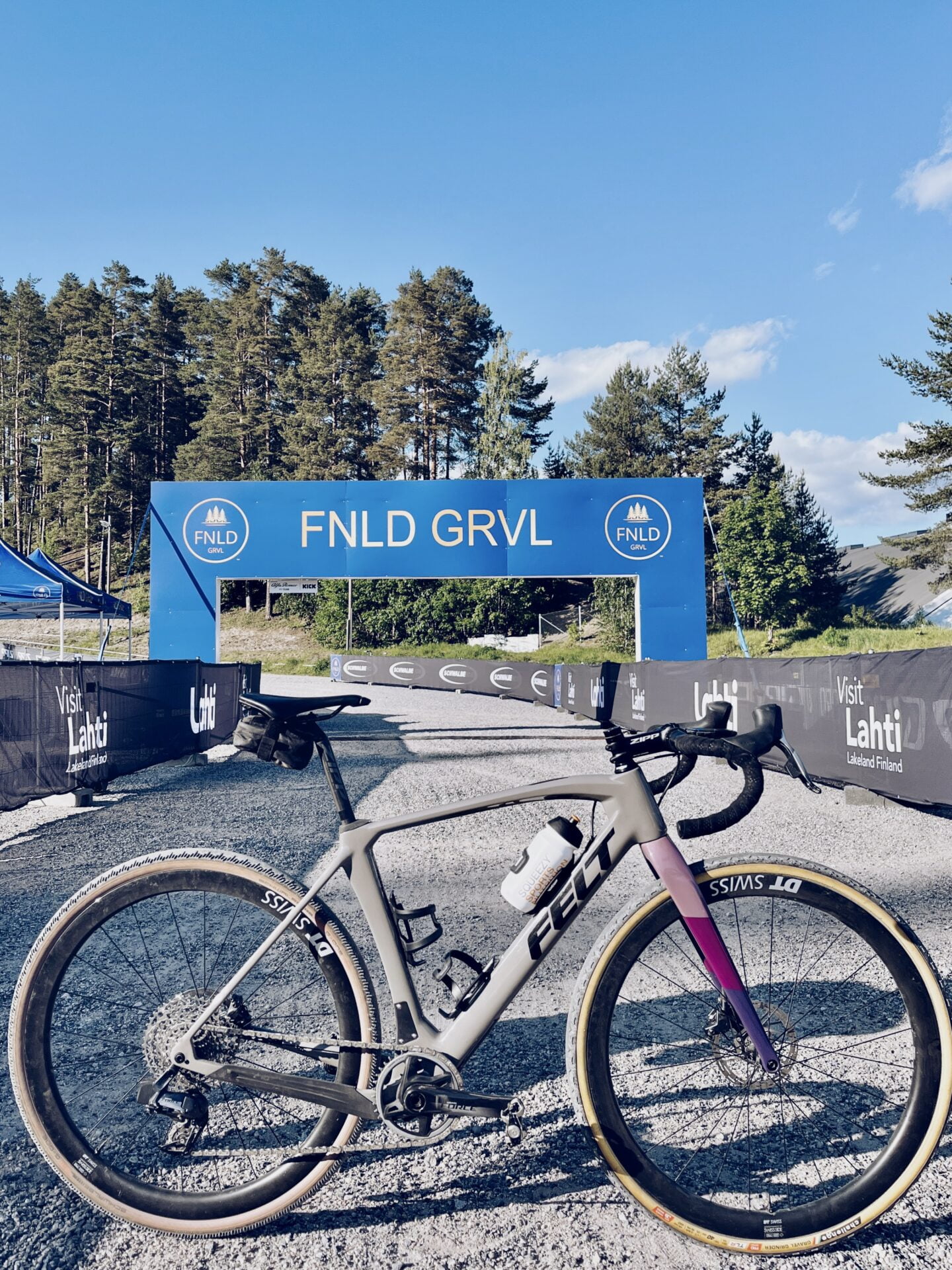 bike in front of FNLD GRVL banner